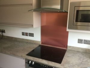 copper splashback behind a hob