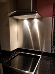 silver splashback behind hob
