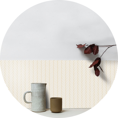 Orange printed herringbone tile splashback
